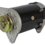 Black cylindrical electric generator motor with brass connector and clear mounting flange