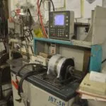CNC lathe machine with control panel and motor assembly in industrial workshop