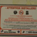 Warning sticker for alternator installation with instructions about battery voltage and charging procedures from S&N Auto Electric.