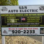 S&N Auto Electric business sign advertising starter, alternator, and motor rebuild services with phone number and Sacramento address